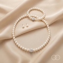 The Pearl Row set laid out on cream silk