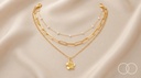 The Blossom Layered set on cream silk, showing all three chains and the flower pendant