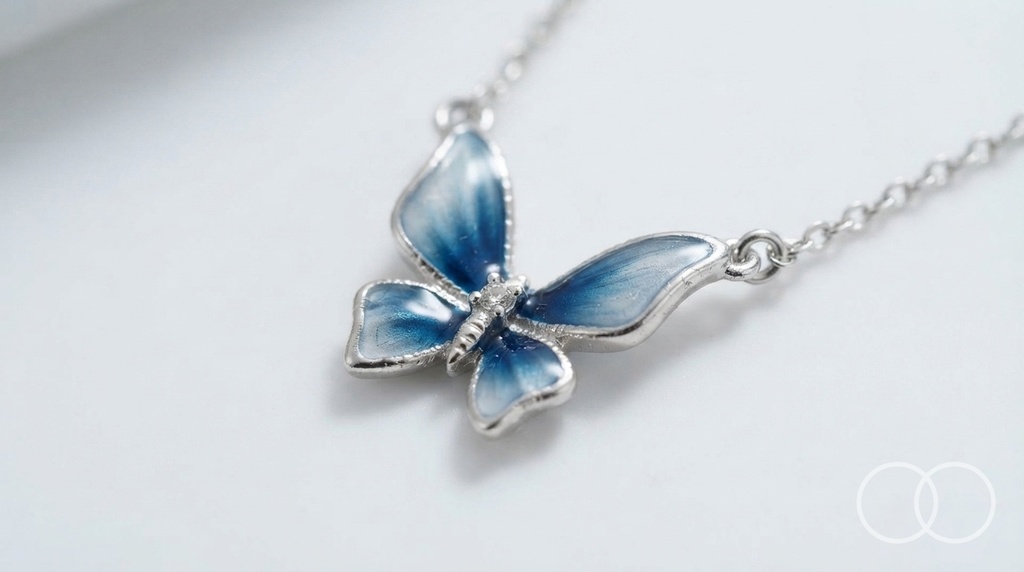 Close up of the blue enamel butterfly pendant and its silver frame
