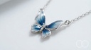 Close up of the blue enamel butterfly pendant and its silver frame