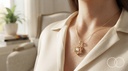 The Six-Point pendant worn over a cream blazer