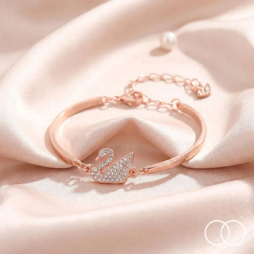 Rose-gold_swan_bracelet_on_silk_202608211701.webp