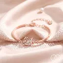Rose-gold_swan_bracelet_on_silk_202608211701.webp