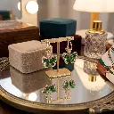 Emerald_earrings_on_mirrored_vanity_202608211715.webp
