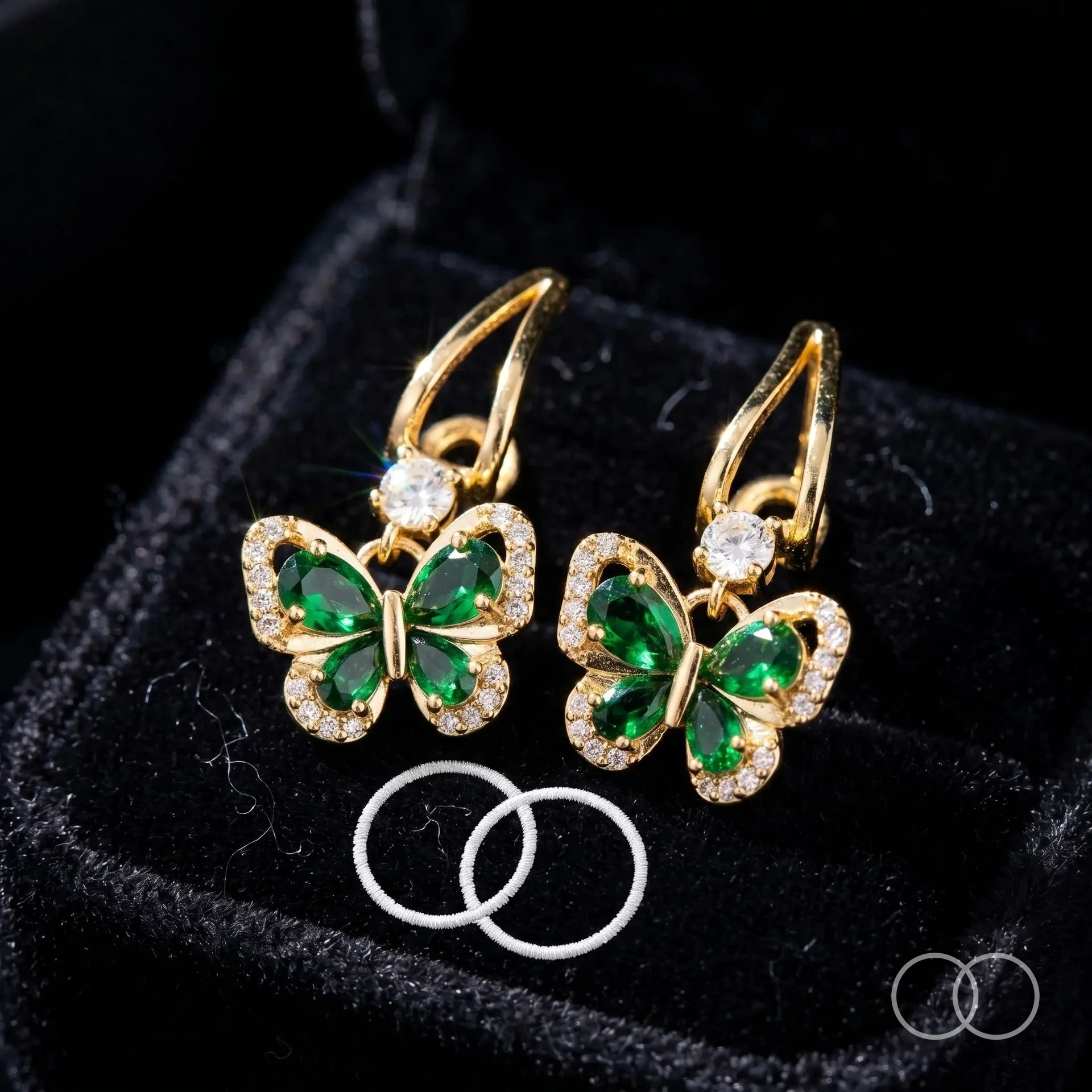 Emerald_butterfly_earrings_on_cu…_202608211655.webp